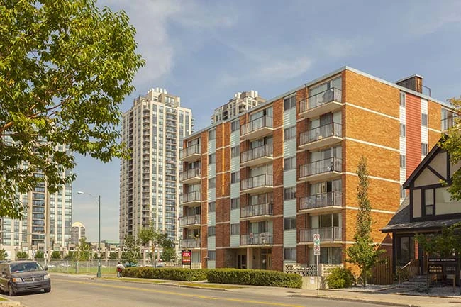 Multi-family rental tower with a Now Renting sign